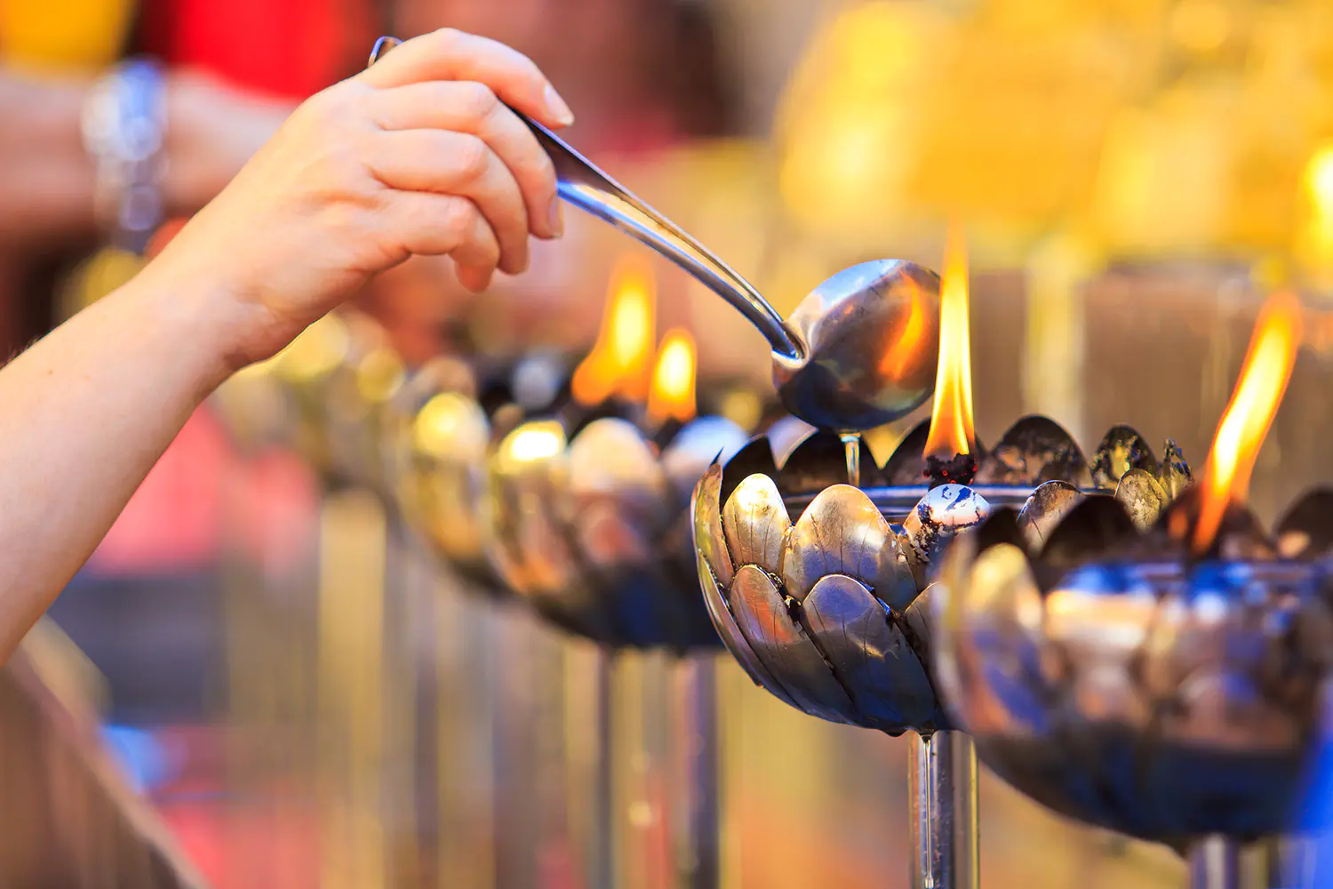 People-fill-oil-in-the-oil-lamp-at-the-temple